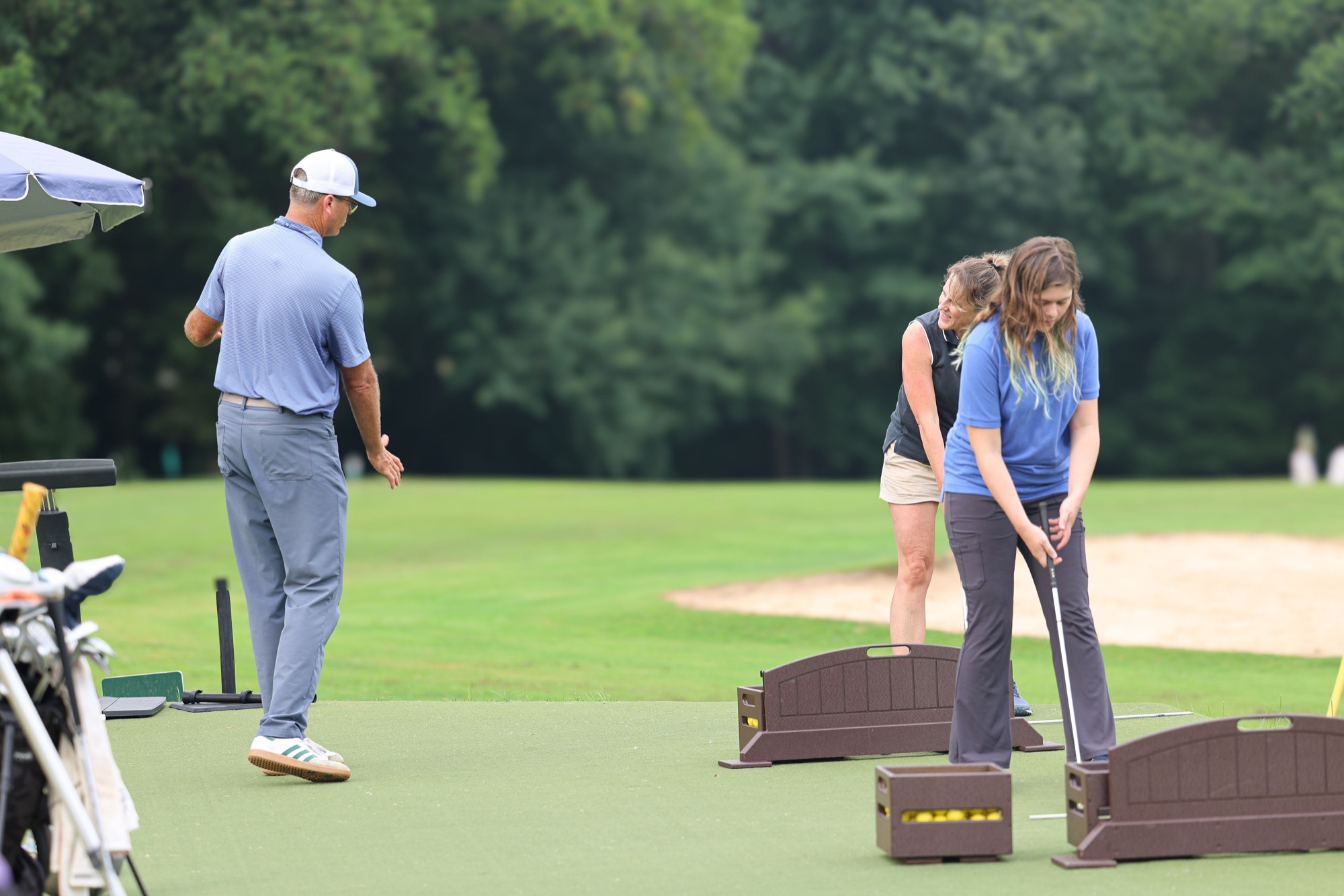 A coach working with beginners during a group lesson